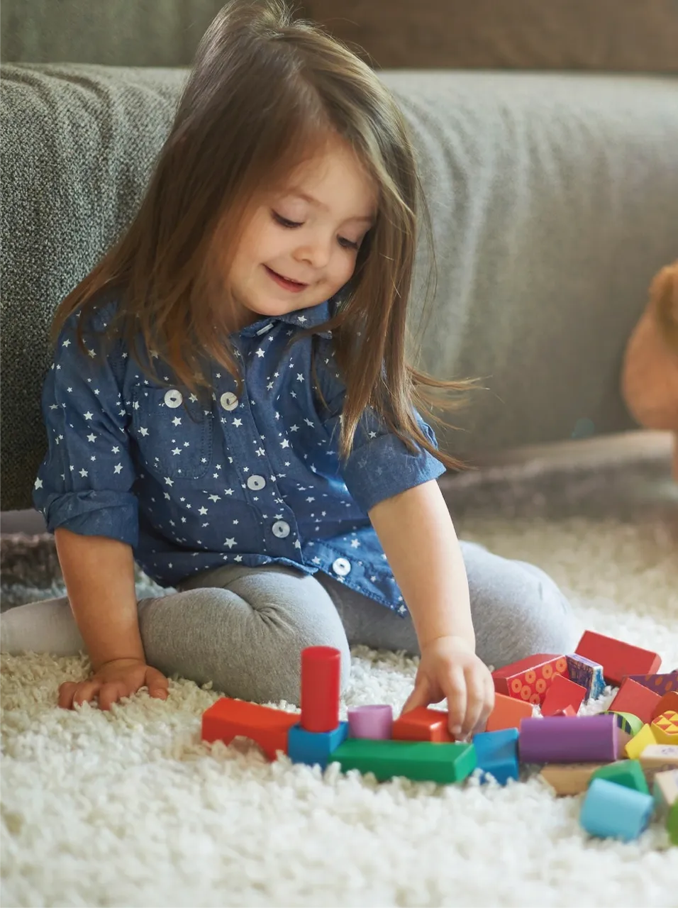 A child playing toy blocks